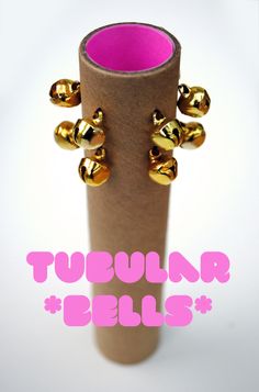 a tube with gold bells on it and the words tupelr rules in pink