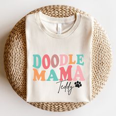 Show off your love for your Doodle with this Doodle Mama t-shirt!  Find more Goldendoodle and Labradoodle mom gifts and shirts here: https://www.etsy.com/shop/JaxGraphicTees?search_query=doodle All of our adult t-shirts are Bella + Canvas 3001 Unisex shirts. They are a super soft fabric that will quickly become a go to in your wardrobe. Its lightweight and flexible material is perfect for casual wear or any activity. Sizing details: * All shirts are unisex sizing, please refer to the size chart Name Doodle, Doodle Mom Shirt, Doodle Shirt, Doodle Mom, New Dog, Dog Mom Shirt, Mom Sweatshirt, Mom Gifts, Labradoodle