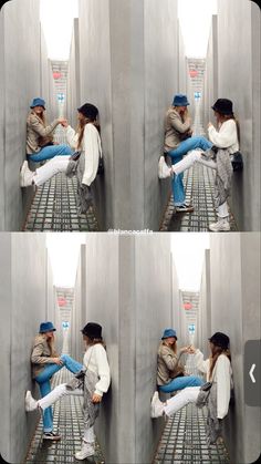 a man and woman sitting next to each other on top of a metal floor in front of a wall