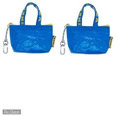 two blue purses with chains hanging from the handles and straps on each one side