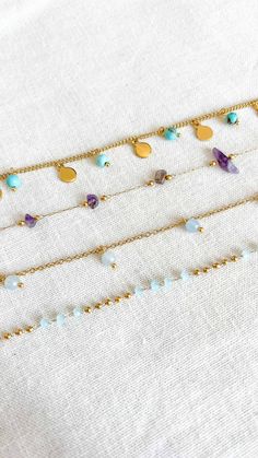 Turquoise anklet pearl anklet surfer anklet gold non tarnish waterproof anklet Choose your favorite non tarnish waterproof anklet from our Atelier Amalfi summer collection. Each anklet is 100% waterproof and hypoallergenic. Anklet Styles: 1. Turquoise anklet 2. Amethyst anklet (variations may occur due to the stones' natural condition) 3. Mini pearl anklet 4. Pearl anklet Each anklet comes with a jewelry pouch, making it the perfect gift for yourself or someone special. Ankle length: 23 cm (9 in Handmade Trendy Gold Anklets, Trendy Handmade Gold Anklets, Amethyst Anklet, Surf Bracelet, Turquoise Anklet, Pouch Making, Anklet Gold, Pearl Anklet, Beach Anklets