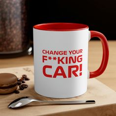 a red and white coffee mug with the words change your f king car on it