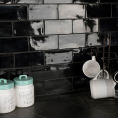 the kitchen counter is clean and ready to be used as a coffee pot or mug