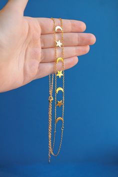 18k gold plated stainless steel Hypoallergenic and nickel free Tarnish resistant and waterproof Adjustable from 13.5-16.5 inches in length to accommodate a variety of neck sizes AHHHH we love a detailed necklace! This sun and moon chain is so fun and will be the perfect addition for our celestial girlies. This is also a great option to layer with some of our other styles, but will obviously look just as beautiful worn alone. Adjustable Delicate Celestial Chain Necklace, Everyday Celestial Charm Necklace With Adjustable Chain, Celestial Style Charm Necklace With Adjustable Chain, Gold Plated, Adjustable Gold Celestial Charm Necklace, Gold Celestial Charm Necklace, Trendy Sun And Moon Design Jewelry As A Gift, Hypoallergenic Gold Moon Jewelry, Celestial Gold Charm Necklace With Adjustable Chain, Moon Chain