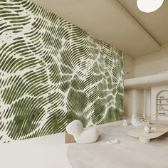 a living room filled with furniture and a wall covered in green leafy designs on it