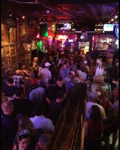 a large group of people standing in a room