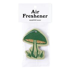 an air freshener sticker with a green mushroom on it