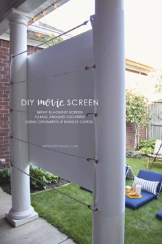 an outdoor screen is set up on the lawn