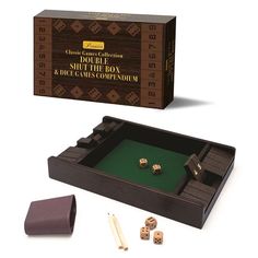 a wooden board game set with dices and pieces in front of the card box