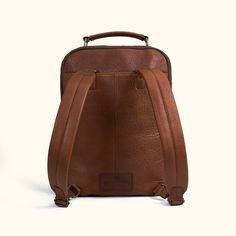 We aimed for the spirit of Roosevelt, of action and purpose, into our new commuter backpack. Crafted from the untamed strength and character of rich full grains of buffalo leather which epitomizes durability and rugged luxurious style. Within its soft but sturdy construction, this backpack unveils a multitude of compartments meticulously designed to accommodate your every need. From safeguarding your laptop (up to 15") with a cushioned section, to providing a secure space for your iPad, notebook Leather Backpack For On-the-go, Soft Leather Backpack For Commuting, Leather Standard Backpack For Commuting, Leather Commuting Backpack, On-the-go Leather Backpack, On-the-go Smooth Grain Leather Backpack, Leather Backpack For Commuting, Brown Leather Backpack For Commuting, Functional Leather Backpack With Leather Handles