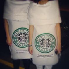 two women in starbucks towels standing next to each other with coffee cups wrapped around them