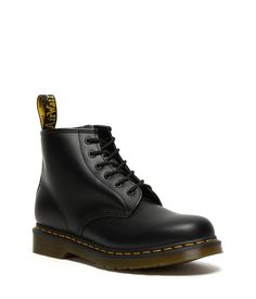 The Dr. Martens® 101 Yellow Stitch boots embodies all the classic clean lines, standout stitching, and edgy attitude of the vintage utilitarian work boot, but in a lower-cut design and a smooth leather construction..Lace-up boots have a smooth leather construction made of a firm, finished leather with a smooth, semi-bright appearance..Six-eyelet boot with sturdy fabric laces for a secure fit..Features classic Doc's DNA including grooved edges, a yellow welt stitch, and a scripted heel loop..Goodyear® welt provides both durability and flexibility..Breathable textile lining..Cushioned insole for long-lasting underfoot support..Air-cushioned rubber outsole is oil, fat, acid, petrol, alkaline resistant and has excellent slip and abrasion resistance..Imported..Product measurements were taken us Classic Chukka Boots For Workwear In Winter, Classic Winter Chukka Boots For Workwear, Classic Winter Workwear Chukka Boots, Casual Ankle Combat Boots For Work, Classic High-top Martin Boots For Fall, Casual High-top Moto Boots For Work, Classic Martin Boots With Goodyear Welt And Round Toe, Classic Waterproof Boots With Reinforced Toe For Work, Casual Moto Boots With Plain Toe For Work