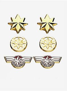 three pairs of gold stud earrings with wings and stars on the front, one in white background