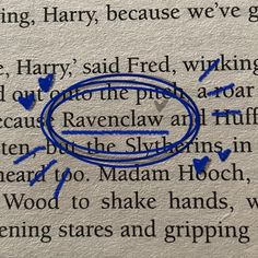 a close up of a book with blue marker writing on the page and an image of harry potter's ring