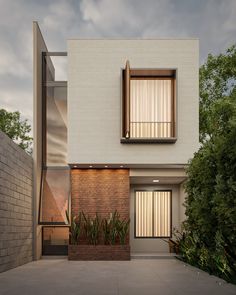 a modern house with brick walls and windows