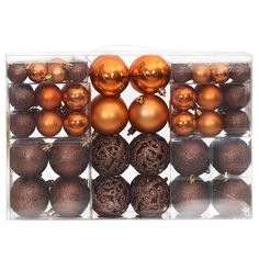 a clear box filled with lots of shiny brown christmas baubs and ornaments on top of each other