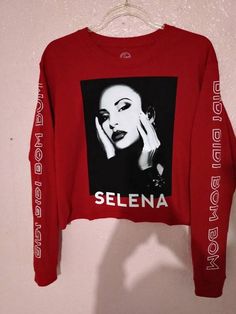 a red sweater with the words selena on it