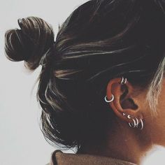 a woman with ear piercings on her ears