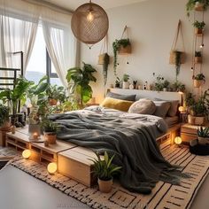 a bedroom with lots of plants and lights