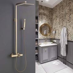 a bathroom with grey walls and gold fixtures, including a shower head and hand held faucet