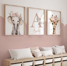 three framed pictures hang on the wall above a bench in a child's room