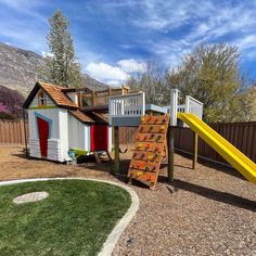 a backyard with a slide and play set