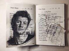 an open book with a drawing of a man's face and bird on it