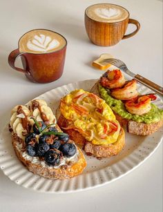 three different types of food on a white plate with a cup of coffee and spoon