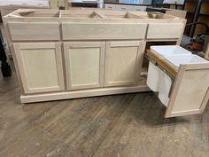 an unfinished kitchen cabinet is being built in the process of being assembled and put together