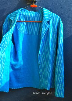 This is a Aqua blue Ikat cotton Jacket/ Blazer most suitable for all occasions. It can be clubbed with a pair of Jeans or skirts with inner tube/ tank top. It has a very soft voile lining inside (shown in Pic 5).   Free size ------- fits small to medium Handfeel --------- Soft Medium Summer Cotton Long Sleeve Blazer, Summer Cotton Blazer With Long Sleeves, Summer Cotton Blazer In Blue, Summer Cotton Blue Blazer, Summer Blue Cotton Blazer, Blue Cotton Blazer, Ikat Jacket, Tube Tank Top, Boho Wear