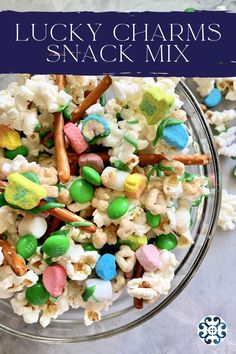 lucky charms snack mix in a glass bowl on a marble surface with text overlay