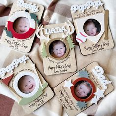 a group of small personalized photo magnets on top of a blanket with the words happy father's day written on them