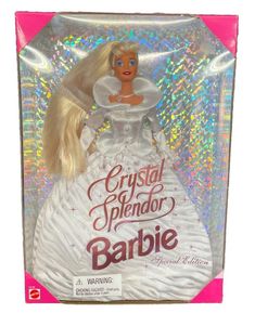 a barbie doll in a white dress with long blonde hair