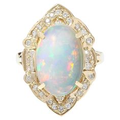 9.05 Carat Natural Opal 14K Solid Yellow Gold Diamond Ring Item Type: Ring Item Style: Cocktail Material: 14K Yellow Gold Mainstone: Opal Stone Color: Multicolor Stone Weight: 8.25 Carat Stone Shape: Oval Stone Quantity: 1 Stone Dimensions: 15.00x10.00 mm Stone Creation Method: Natural Stone Treatment Method: Not-treated Gemstone 1: Diamond Stone Color: F-G Stone Clarity: VS2-SI1 Stone Weight: 0.80 Carat Stone Shape: Round Stone Creation Method: Natural Stone Treatment Method: Not-treated Total Opal And Diamond Ring, Opal Diamond Ring, Opal Birthstone, Yellow Gold Diamond Ring, Gold Diamond Ring, Yellow Gold Engagement Rings, Opal Stone, Oval Stone, Creative Jewelry