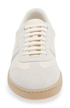 A vintage-inspired profile defines this low-top sneaker made of calfskin leather with suede overlays and finished with the founder's signature at the heel. Lace-up style Removable insole Leather upper and lining/rubber sole Made in Italy Men's Designer Shoes Cream Leather Sneakers With Contrasting Heel Counter, Cream Leather Sneakers With Contrasting Heel, Luxury Low-top Sporty Men's Shoes, Low-top Calf Leather Sneakers With Textured Sole, Gold Lace Up Heels, Low-top Synthetic Sneakers With Leather Sole, Luxury Leather Slip-on Sneakers With Textured Sole, Luxury Low-top Sneakers With Vibram Sole, Lipstick Bag