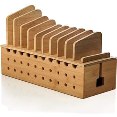 a set of six wooden cutting boards in a holder