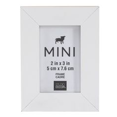 a white photo frame with an image of a dog in the middle and text that reads mini