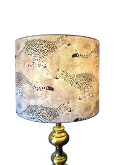 This beautiful lampshade has been covered in a stunning Harrison Howard fabric featuring cheetahs, flamingos and lots of fauna and flora. It is sure to  make a statement in any room.  Handmade in beautiful Greenville, SC. All lampshades have a single seam and rolled edges. Please note that the pattern placement can vary however I try my best to ensure optimal placement each time. The pattern will not always match up at the seam. The shape of the shade is a drum shape which means the top and bott Harrison Howard, Fauna And Flora, Cheetahs, Drum Lampshade, Greenville Sc, Led Light Bulb, Harp, Lamp Shades, Live Light