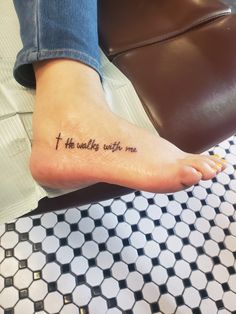 a person with a tattoo on their foot that reads, i the walking with me