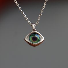 Minimalist Eye Necklace, Little Cute Eye Pendant, Green Tiny Eye Necklace, Personalized Design Necklaces, 925K Silver Pendant, Gift Idea My eye designs can be made specifically for your eyes, you need to take a beautiful iris photo for us. Then we can customize it for you. You can also add or remove blood details to our eye designs. You can write this in the order notes. Please send me a message after ordering. I can do as you wish. A quasi-universal symbol of protection, the evil eye is referre Sterling Silver Necklace With Polished Finish, Custom Round Sterling Silver Necklace With Polished Finish, Green Sterling Silver Charm Necklace, Sterling Silver Hallmarked Round Pendant Necklace, Unique White Gold Nickel-free Necklace, Green Sterling Silver Charm Necklace With Round Pendant, Sterling Silver Gemstone Pendant Charm Necklaces, Handmade Sterling Silver Necklaces Fine Jewelry, Unique Everyday Sterling Silver Necklaces