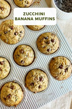 zucchini banana muffins in a muffin tin with chocolate chips on the side