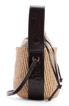 Elevate your warm-weather look with this compact basket bag designed with a drawstring lining and a leather version of the logo-embellished Woody strap. Drawstring closure Top carry handle; crossbody strap Lined Paper straw with leather trim Made in Italy Designer Handbags This brand has B Corp certification, representing business practices with emphasis on social and environmental performance, accountability and transparency This brand meets Nordstrom Responsible Brands criteria: brand adheres Luxury Straw Bag With Leather Trim And Top Handle, Designer Natural Bucket Bag With Braided Handles, Luxury Leather Straw Bag With Adjustable Strap, Luxury Leather Trim Bags For Vacation, Luxury Basket Bag For Everyday, Luxury Basket-shaped Everyday Bag, Luxury Woven Leather Bucket Bag For Summer, Luxury Straw Bag With Adjustable Strap For Travel, Luxury Natural Pouch Bucket Bag