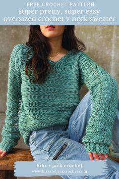 a woman sitting on top of a wooden bench wearing a green knitted sweater and jeans