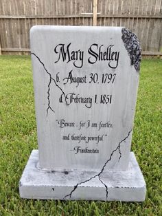 a grave marker in the grass with an inscription on it that reads mary sheley