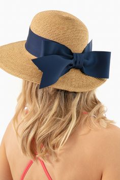 Toucan Hats makes our best-selling and beloved beach accessories.This bow-trimmed hat offers pretty protection from the sun with a nautical navy ribbon detail. Wear to the beach with your favorite caftan for a classic, feminine, and practical finishing touch. The best part? It's packable so it will easily fit in your suitcase or weekender, and keeps its shape after you pull it out. Wide brim Navy bow detail Packable Material: Woven Straw Navy Beach Hat, Chic Sun Hat With Bow For Vacation, Vacation Boater Hat With Bow And Short Brim, Straw Hat With Bow For Vacation, Chic Vacation Sun Hat With Bow, Beach Straw Boater Hat With Bow, Kentucky Derby Beach Straw Hat With Bow, Elegant Beach Hats With Bow, Summer Sun Hat With Bow For Kentucky Derby