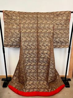 A beautiful antique Japanese Wedding Kimono (Uchikake) made from handwoven Obi silk brocade. Circa early 1900s. This was part of my aunt's textile collection and would retail for around $700-$900. Very good condition. Elegant Gold Kimono For Wedding, Vintage Silk Kimono For Wedding, Traditional Gold Ceremonial Kimono, Traditional Gold Kimono For Festive Season, Traditional Gold Kimono For Festive Occasions, Brown Traditional Wear With Patterns For Wedding, Silk Kimono For Wedding And Festive Occasions, Traditional Gold Kimono For Wedding, Elegant Gold Kimono For Ceremonial Occasions