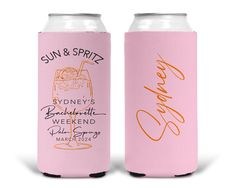 two pink can coolers with orange writing on the front and bottom, one has a drink in it