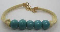 #1203 Handmade, Hand Beaded Suede Cream with Teal Beads Bracelet.. 7-9".. $10 and $4 postage for any item under $20 ..This item and items for the entire family can be found at my website www.charmedbycharmsbycindy.com Stop over and visit and see all my amazing items that I have for sale.. Thanks !!! Beads Bracelet, Rope Bracelet, Bracelet, Cream