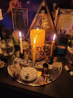 a table topped with candles and other items