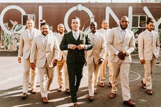 a group of men in suits and ties walking together